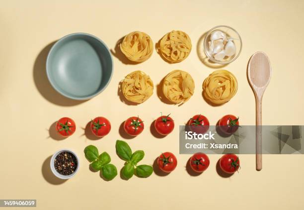 Vegan Pasta Ingredients With Cherry Tomatoes Basil And Garlic Knolling Concept Stock Photo - Download Image Now