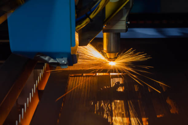 istock Laser cutting machine working with sheet metal with many sparks 1459406252
