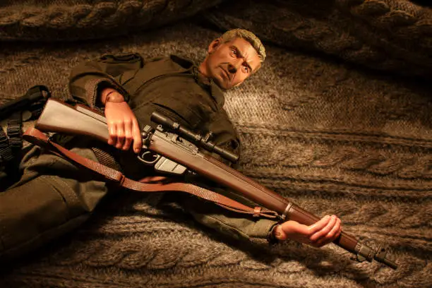 Photo of Action figure soldier holding a bolt-action sniper rifle