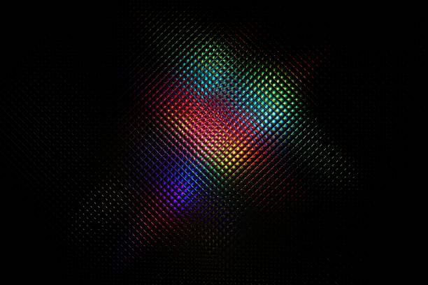 Holographic rainbow multicolor light. Glares with spectral gradient on a dark background. Imitation of rainbow color. Background with texture.