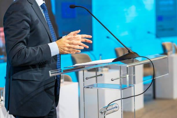 istock Speaker at business conference or presentation. Public speaking event. 1459409561