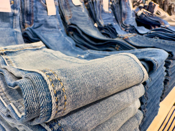 istock Stack of blue jeans in a shop 1459409596
