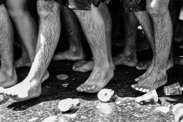 istock Bare feet close up of people on a religious procession 1459412710