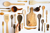 Wooden kitchen utensils on white background - knolling concept