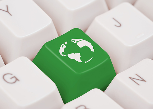 Earth icon on green computer key