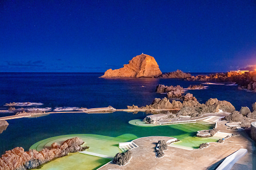 Sunset view of natural lava pools at night in Porto Moniz.