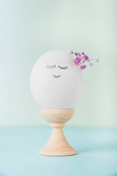 istock Easter eggs with painted face as concept for festive spring card.. 1459422705