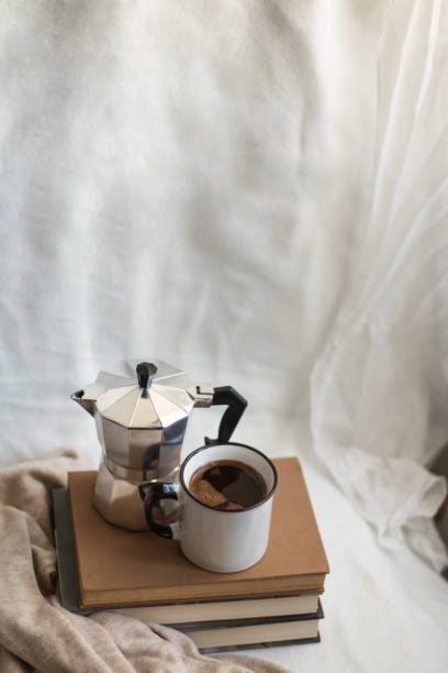 istock Simple composition of indoor relaxing with coffee and books. 1459424073