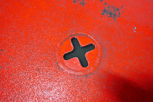 X shaped strap fastening point on a ferry deck for securing vehicles and cargo.