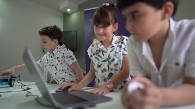 Children learning to program robot vehicle in the classroom
