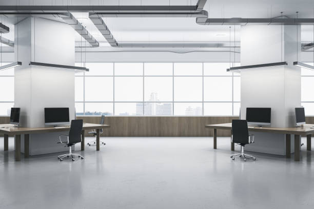 istock Modern spacious coworking office interior. Wooden and concrete materials. Panoramic window with city view and daylight. Corporation, law and legal concept. 3D Rendering. 1459430905