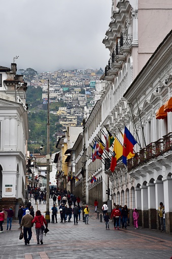 Tourists and locals line the streets of downtown Quito, Ecuador