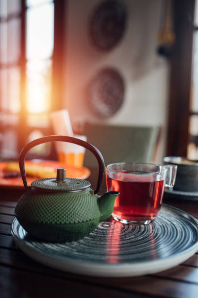 istock Iron teapot and a cup of herbal tea on table 1459436036