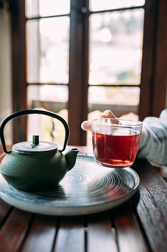 Woman holding a cup of herbal tea