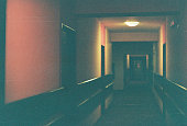 Dark corridor. Scanned film photo. Dust and scratches on photo.