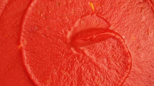 Fresh tasty tomato sauce close up. The concept of Mediterranean cuisine. Rotation. Up close