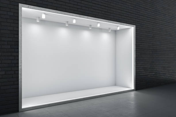 istock Perspective view on blank white niche with place for car or product presentation and glowing lamps on top in abstract empty hall with dark brick wall background and glossy floor. 3D rendering, mockup 1459438151