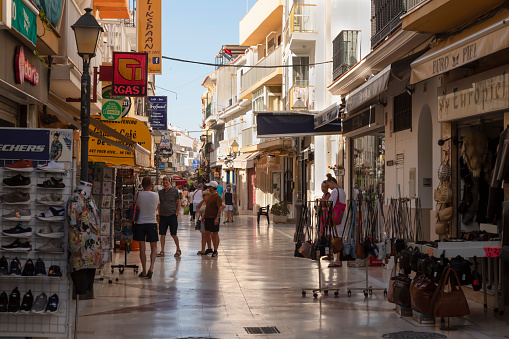 Torremolinos, Spain, June 10, 2022; Cozy street with small shops, restaurants and bars in the La Carihuela area of ​​Torremolinos town
