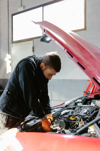 istock Car mechanic working in a garage 1459441637