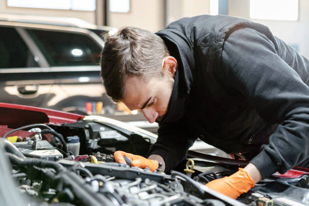 istock Car mechanic working in a garage 1459441639