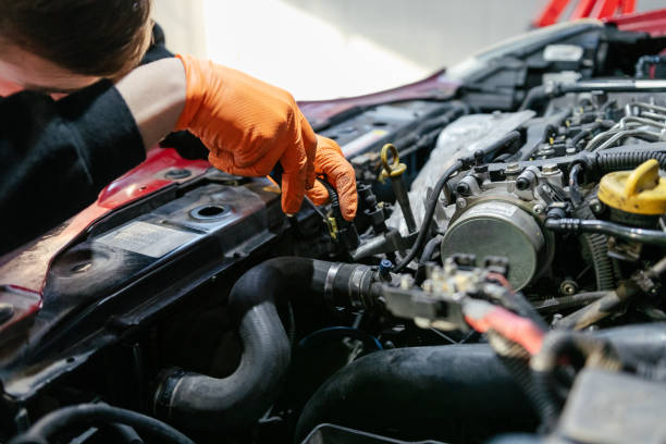 istock Car mechanic working in a garage 1459441667