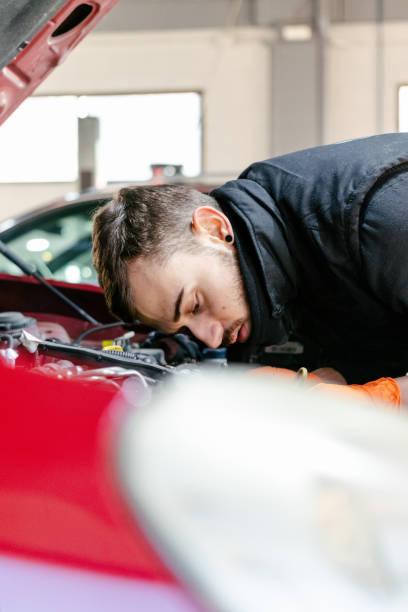 istock Car mechanic working in a garage 1459441803