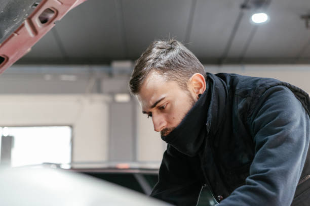 istock Car mechanic working in a garage 1459441820