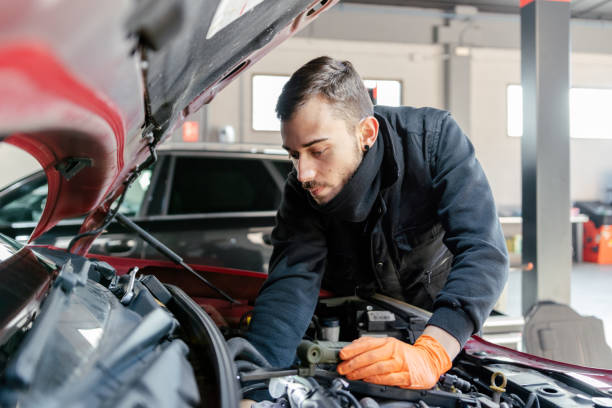 istock Car mechanic working in a garage 1459441903