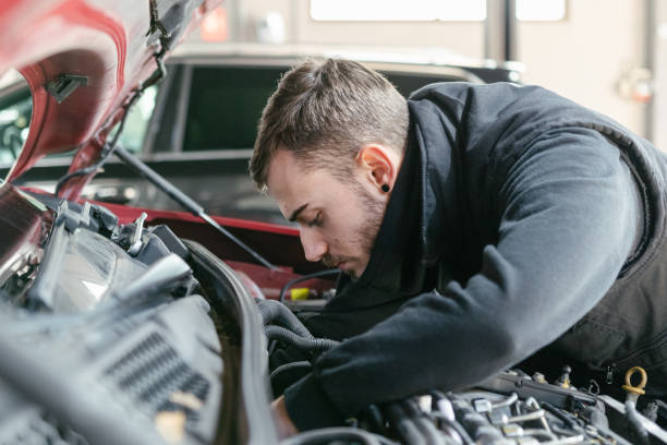 istock Car mechanic working in a garage 1459441945