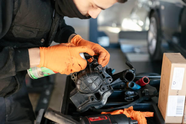 istock Car mechanic working in a garage 1459442056