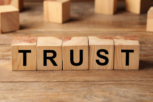 istock Cubes with word TRUST on wooden table 1459443891