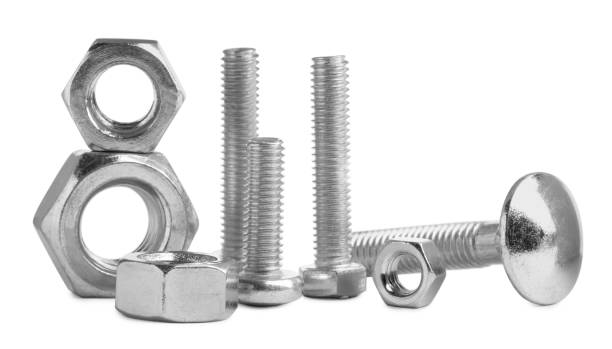Different metal bolts and nuts on white background Different metal bolts and nuts on white background bolt fastener stock pictures, royalty-free photos & images
