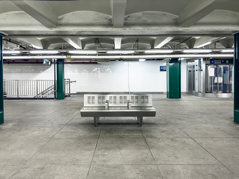 Empty bench in an empty subway station in New York City