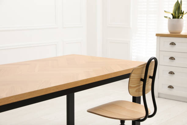 istock Wooden table with office chair in room 1459445808