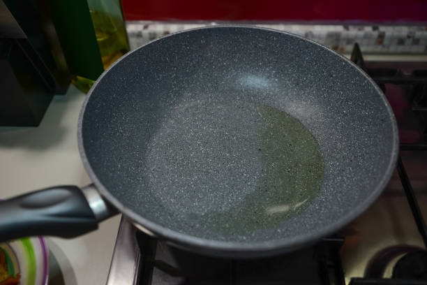 istock Frying pan with cooking oil on stove 1459445884