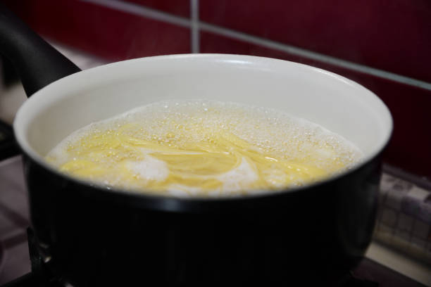 istock Cooking pasta in saucepan on stove, closeup 1459446521