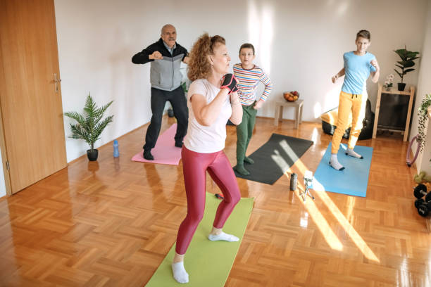 istock Multi-generation family exercising at home 1459447785