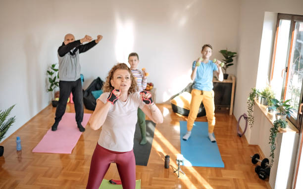 istock Multi-generation family exercising at home 1459447861
