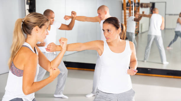 istock Two woman is training on self defense course in gym 1459449650