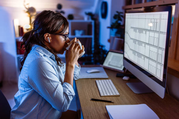 istock Trying to stay awake during night work in the office 1459451495