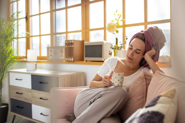 istock Woman relaxing on sofa 1459453006