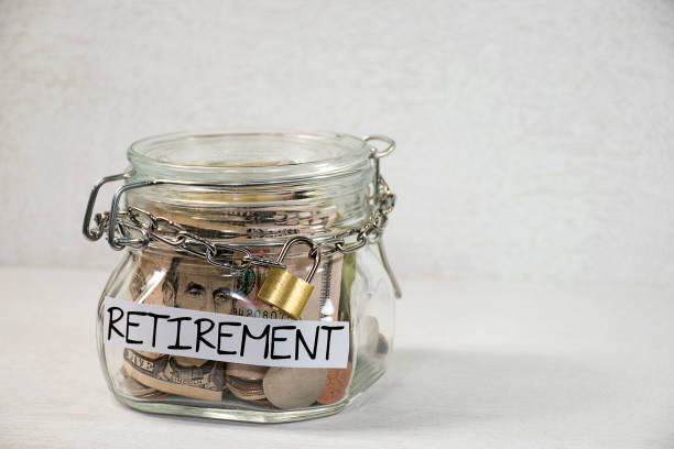 istock Retirement Money in a Glass Jar with Padlock 1459453033