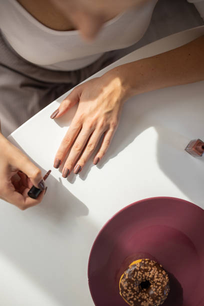 Woman applying nail polish