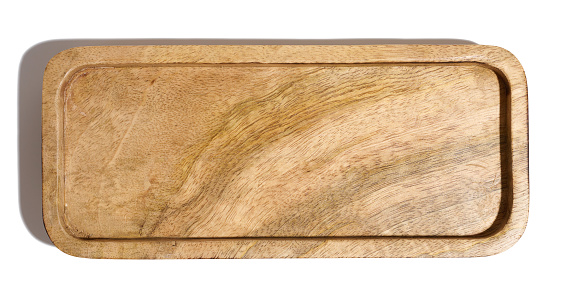 Rectangular wooden plate for serving food on a white isolated background, top view