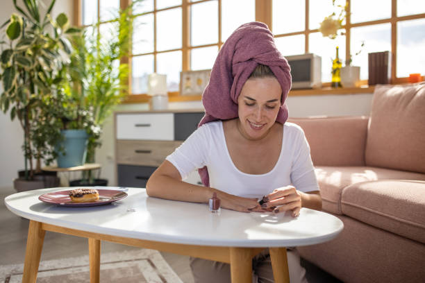 istock Woman doing manicure at home 1459453178