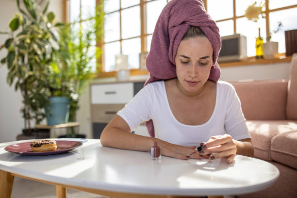 Woman doing manicure herself