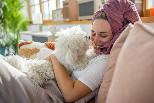 istock Woman playing with her dog 1459453809