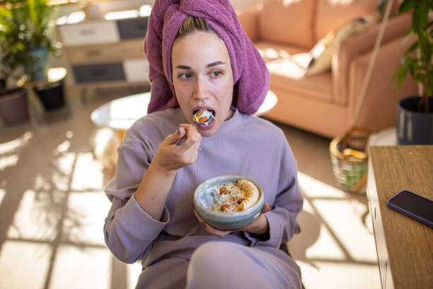 istock Woman eating a healthy meal 1459453886