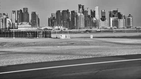 Doha skyline from the airport runway at dawn, Qatar