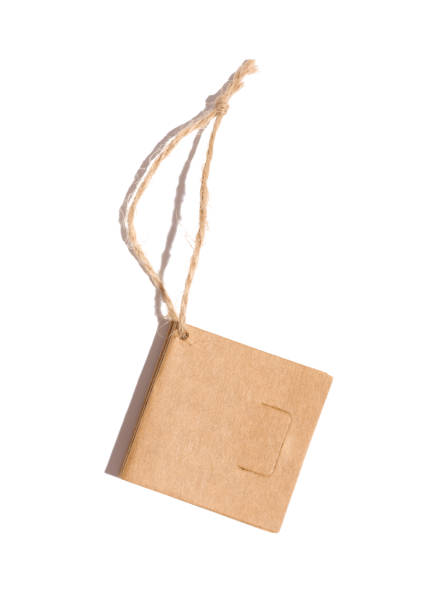 istock Brown paper square paper tag with a rope on a white isolated background 1459455105